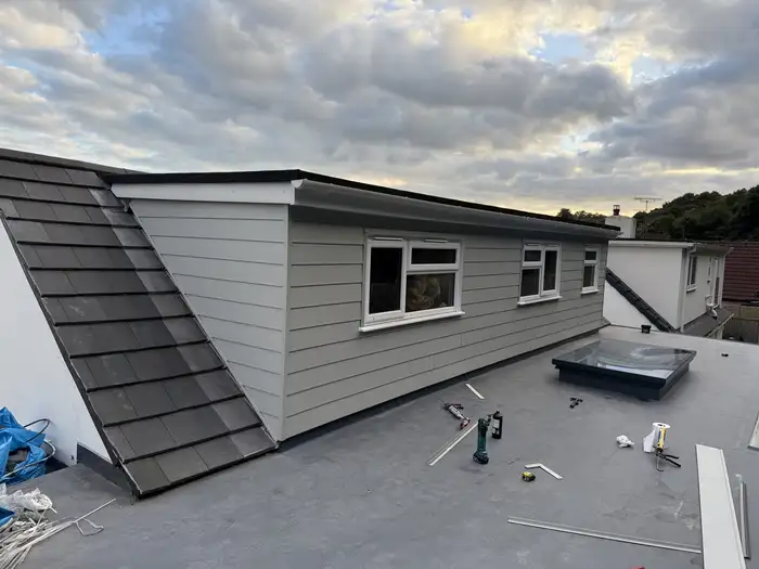 Cladding — after, new cladding fitted to the dormer extension