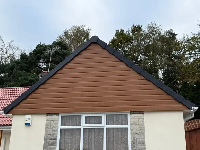 Cladding — after, new cladding fitted to the gable end