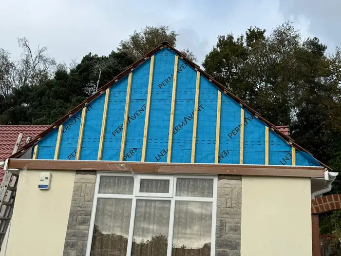 Cladding — during, breather membrane fitted to the gable end