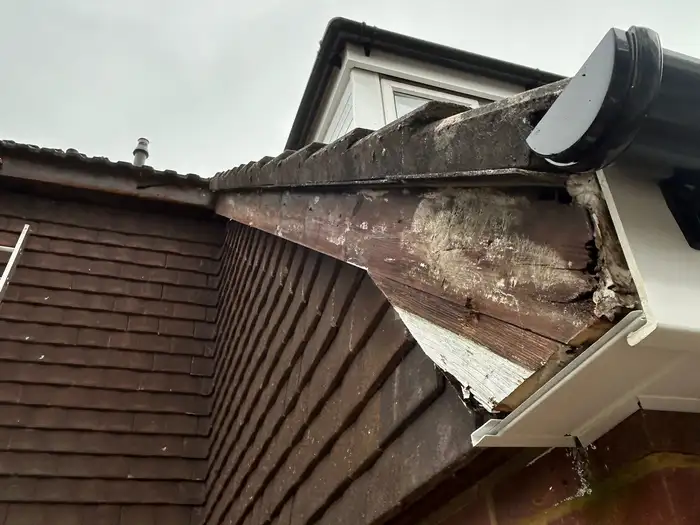 Fascia — before, close-up of the old rotten timber fascia board