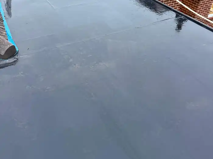 Flat roof extension — after, finished EPDM covering complete, viewed from the other side