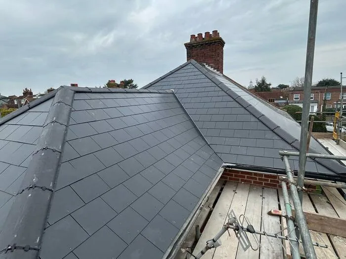 Full re-roof — finished, hip roof and chimney