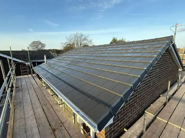 Full re-roof — finished, ridge and roofline detail