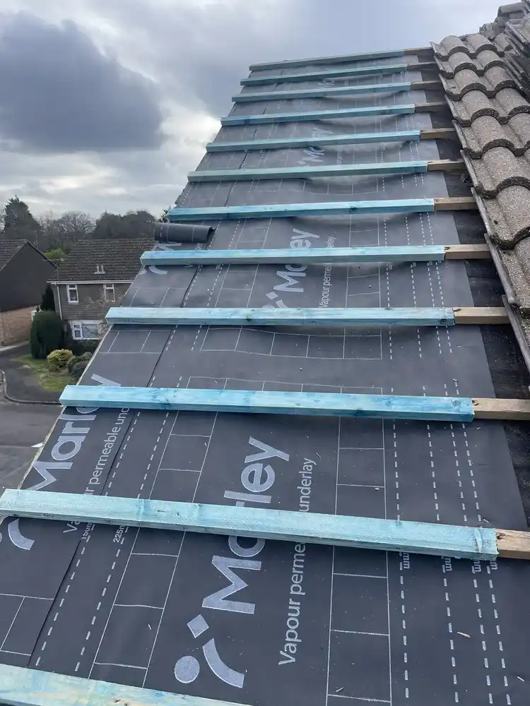 Roof repair — new breather membrane and battens fitted, ready for tiling