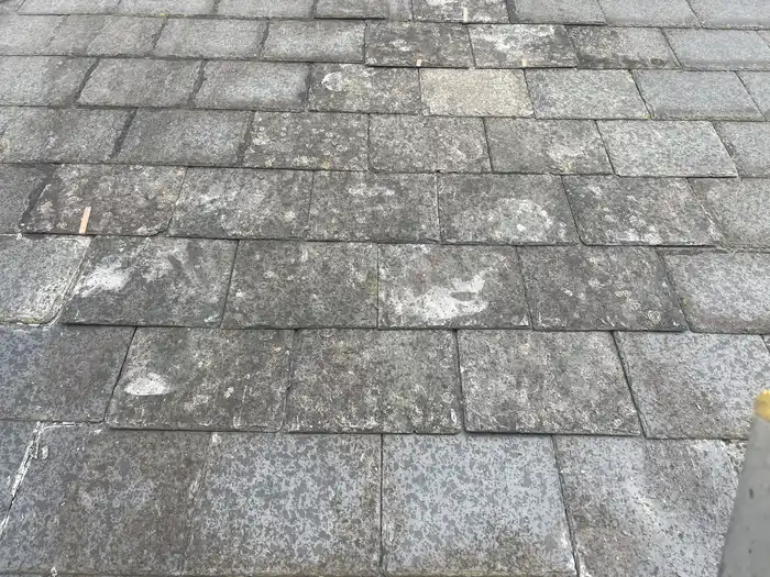 Roof repair — after, matching slate tiles refitted